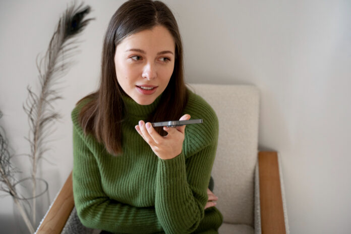 woman talking her smartphone using handsfree feature